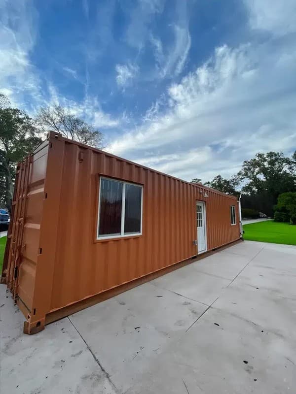 40ft Shipping Container Home 320 sq ft, 1 bedroom with cargo door entry.