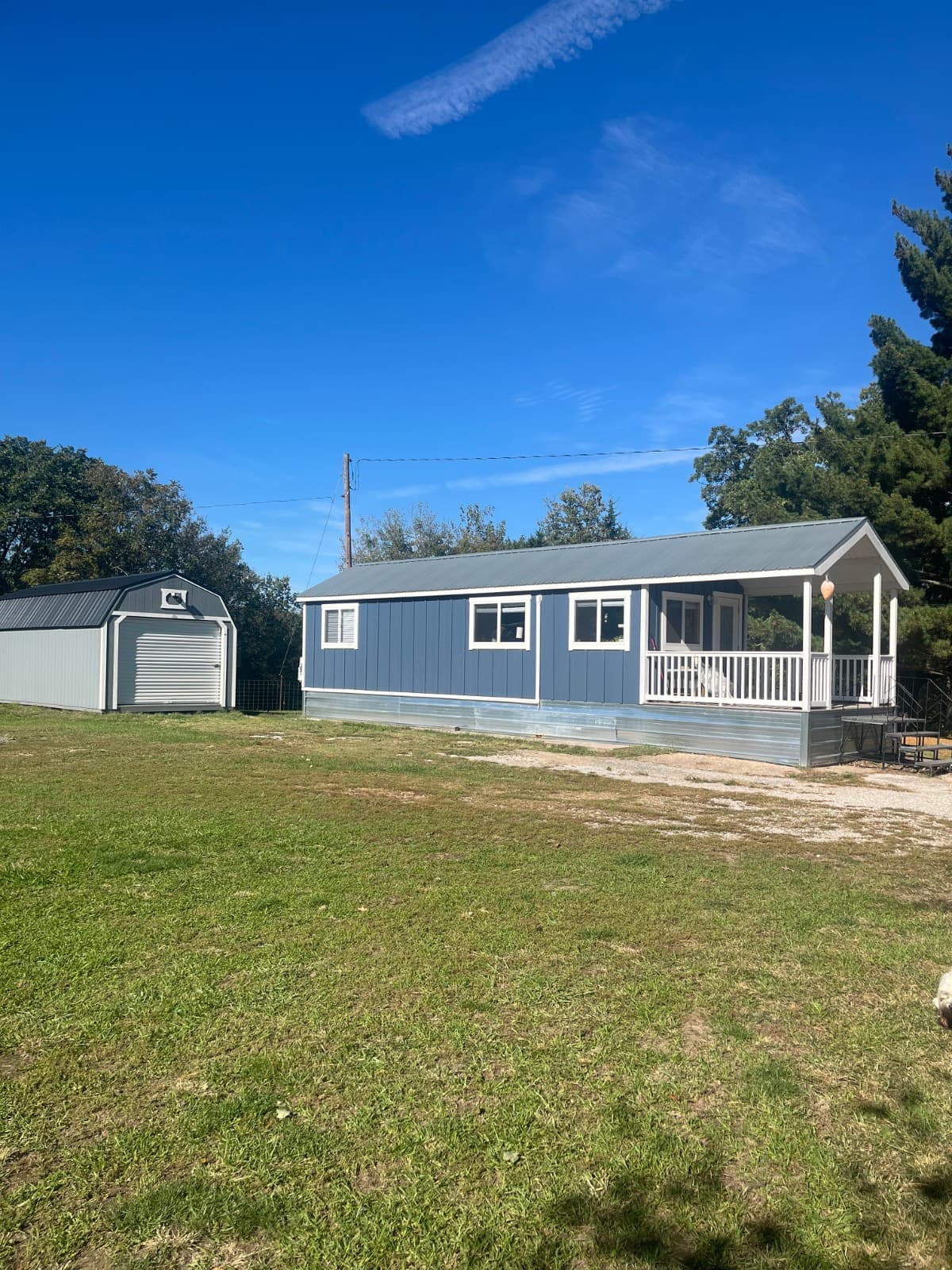 400 SF Lancaster Log Cabin Park Model and 12x28 Derksen Storage Shed