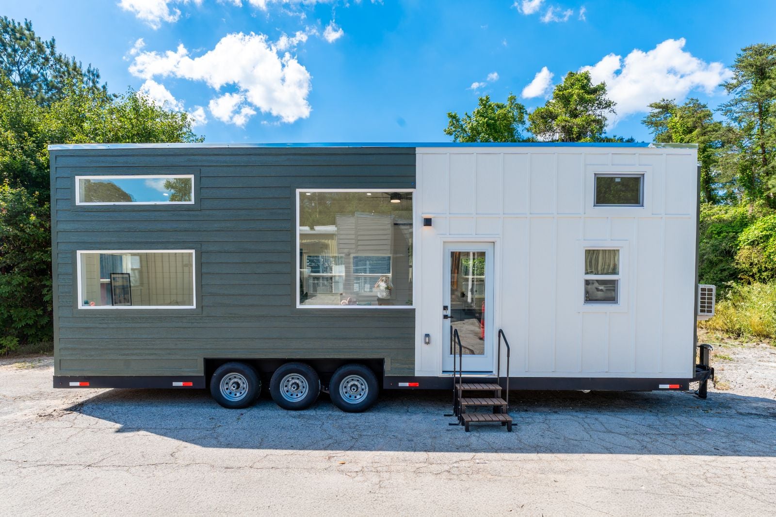 32’ Tiny Home featuring efficient layout, full kitchen, complete bathroom, first-floor bedroom, and dual lofts
