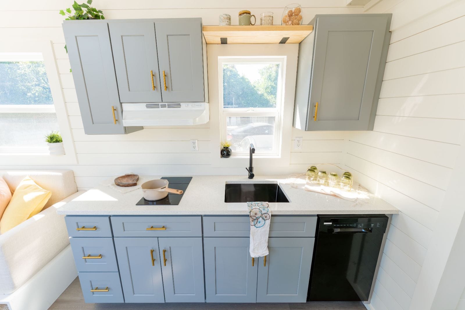 32’ Tiny Home featuring efficient layout, full kitchen, complete bathroom, first-floor bedroom, and dual lofts - Image 3