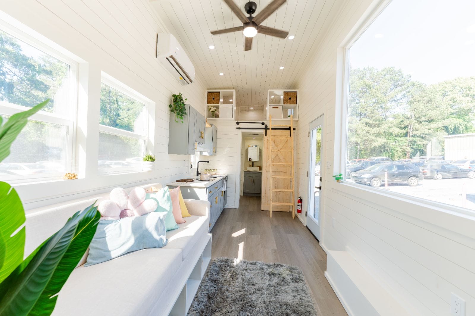 32’ Tiny Home featuring efficient layout, full kitchen, complete bathroom, first-floor bedroom, and dual lofts - Image 4