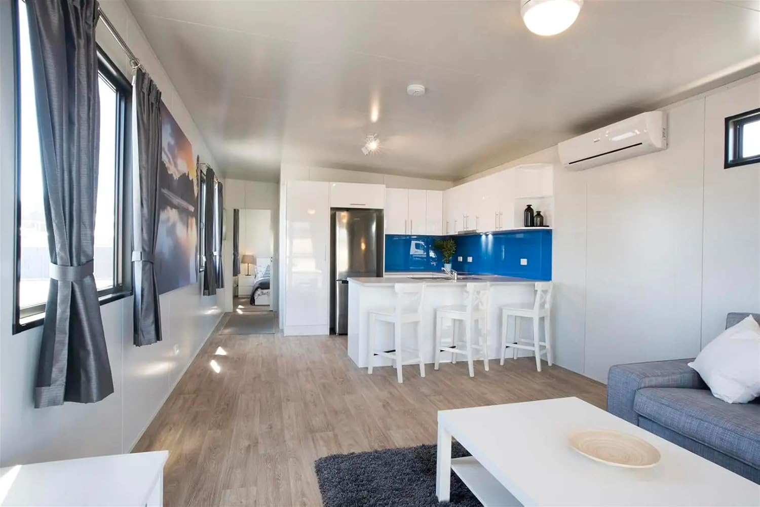 Modern Tiny House with Porch – 260 Sq Ft White Exterior with Black Trim, Glass Windows & Doors - Image 3