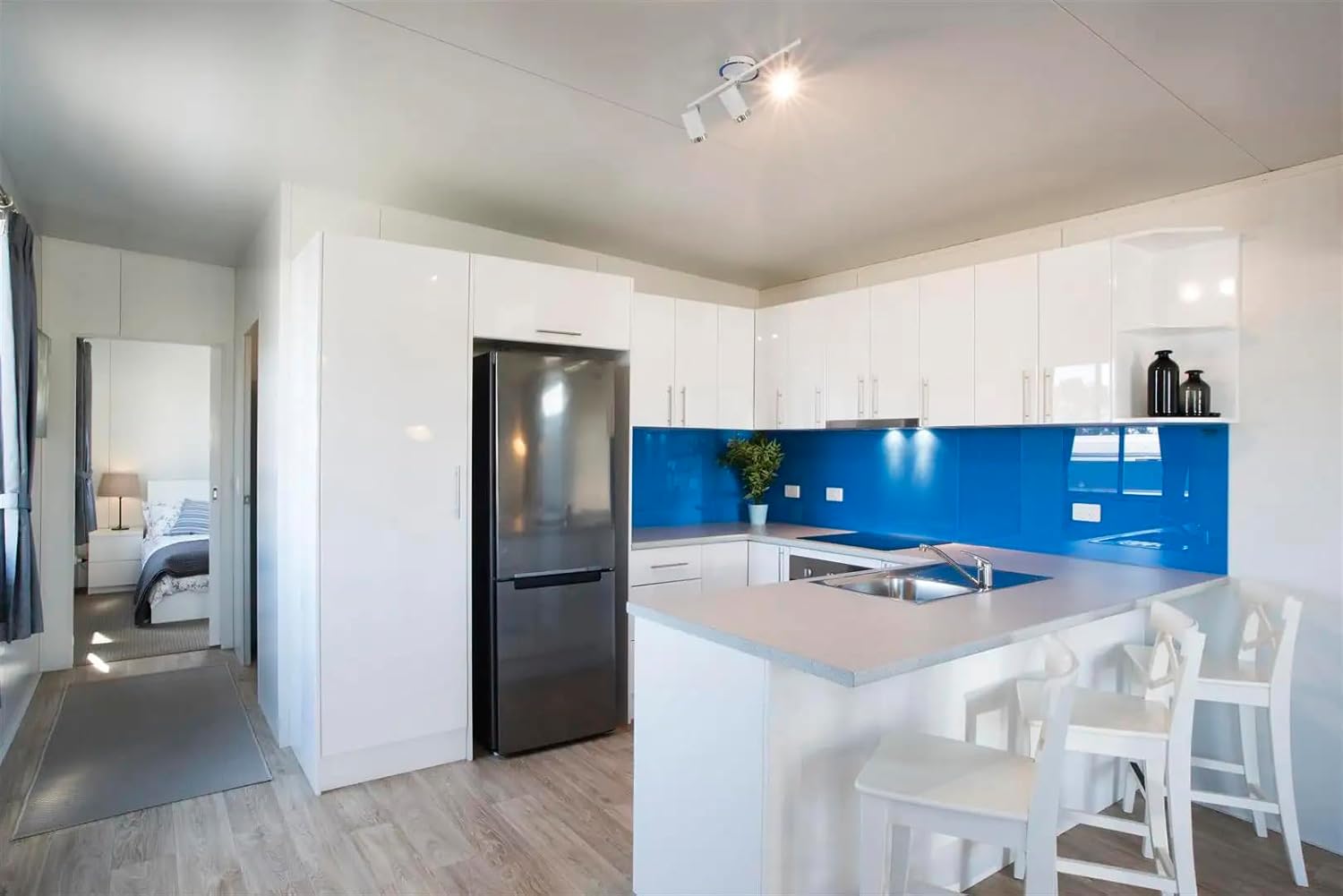 Modern Tiny House with Porch – 260 Sq Ft White Exterior with Black Trim, Glass Windows & Doors - Image 4
