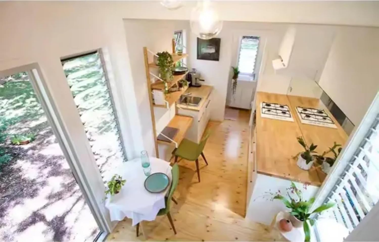 24-Foot Mobile Tiny House with Wood & Metal Exterior – Dual Axle Trailer and Glass Entry - Image 4