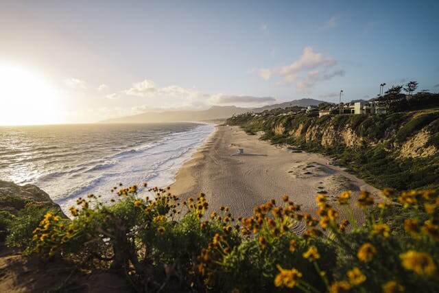 California tiny house community with small homes, shared amenities, and scenic landscape