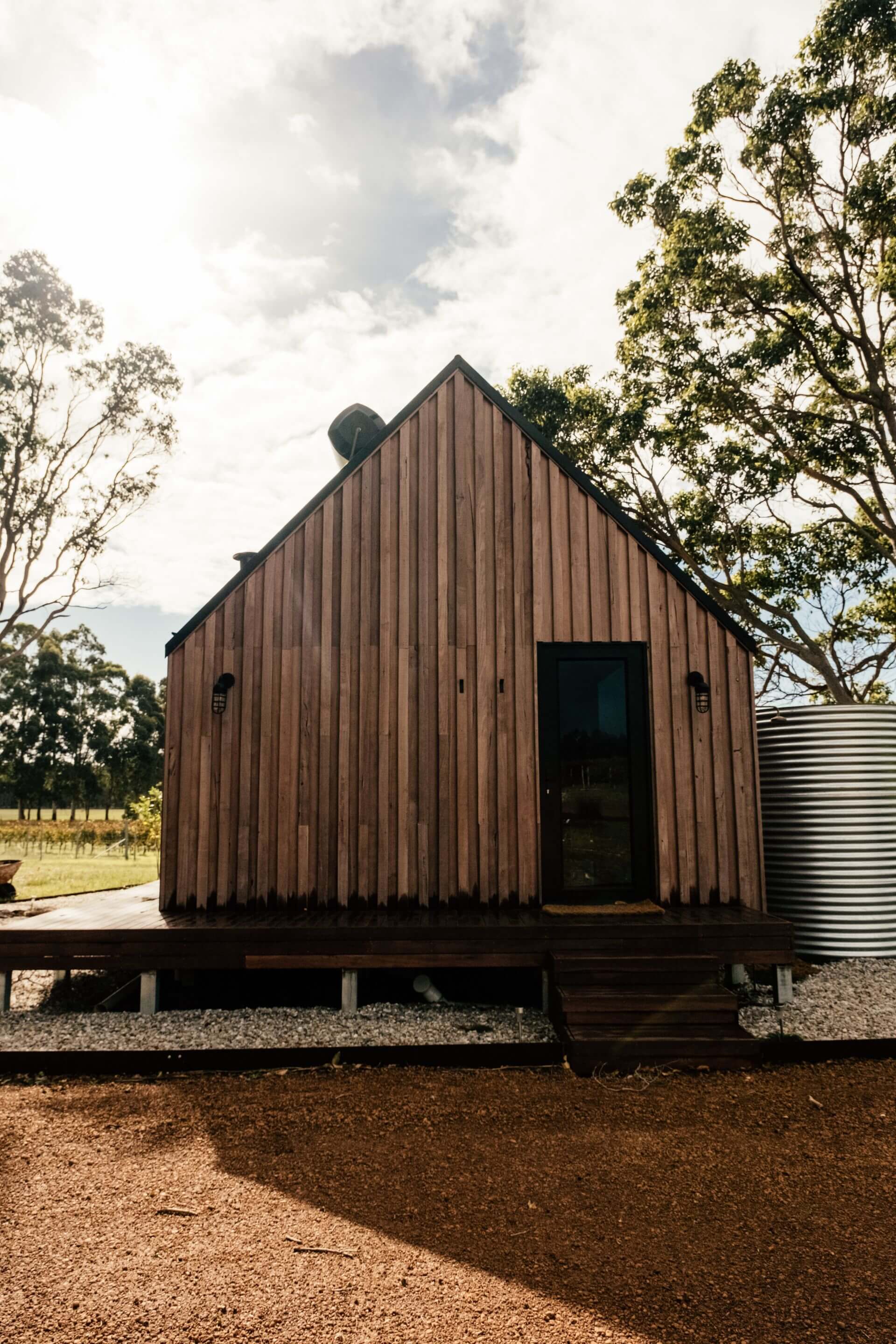 Maine tiny house community with small homes, shared amenities, and scenic landscape